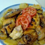 Pollo entero troceado al horno con patatas