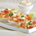 Ensalada de endibias, zanahoria, manzana, nueces y pasas