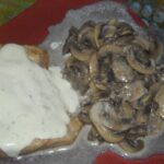 Secreto ibérico al roquefort con champis al vino blanco