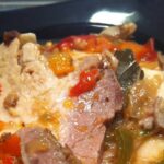 Redondo de cerdo en salsa de pimientos