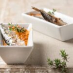 Sardinas con salsa de pimientos