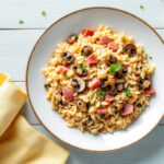 Arroz meloso con jamón y setas