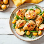 Muslos de pollo con patatas y manzanas